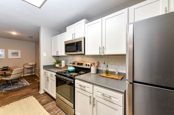 Kitchen appliances cabinets and sink at Lake Cameron Apartment Homes, Apex, NC 27523